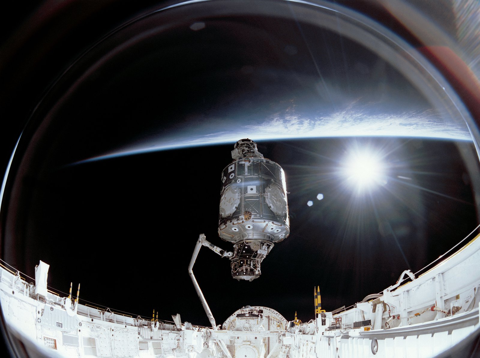 The STS-88 mission of December 1998, during which a drifting object later identified as a lost thermal blanket was photographed