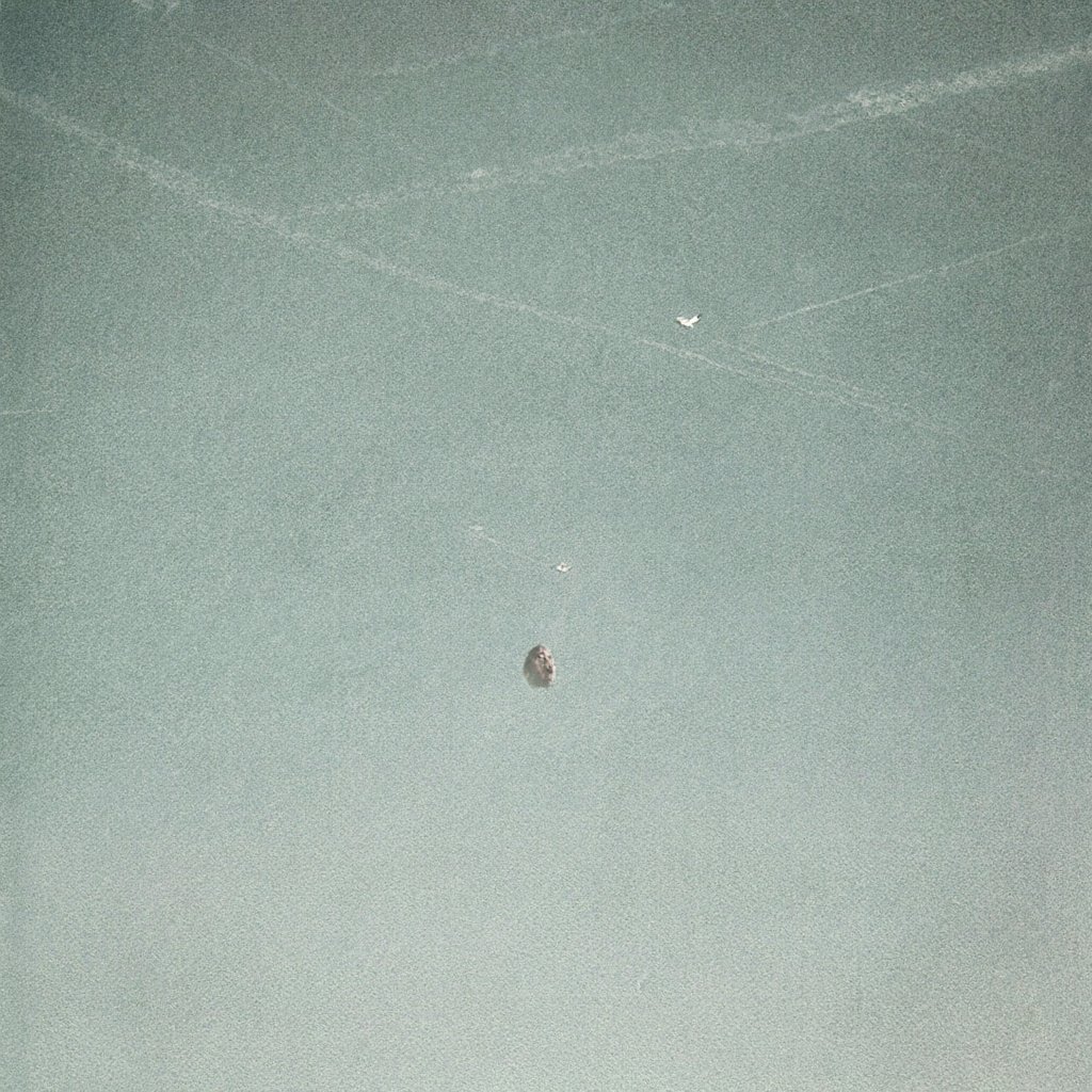 Illustration looking straight up at an empty sky crossed by white aircraft trails, a distant airliner leaving one of them