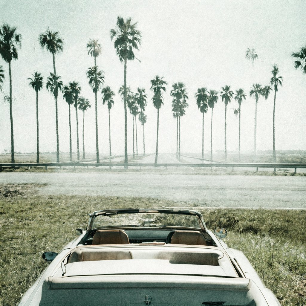 Illustration of an empty white convertible with its top down, parked on the shoulder of a wide Florida interstate under a hazy sky, deserted, no people